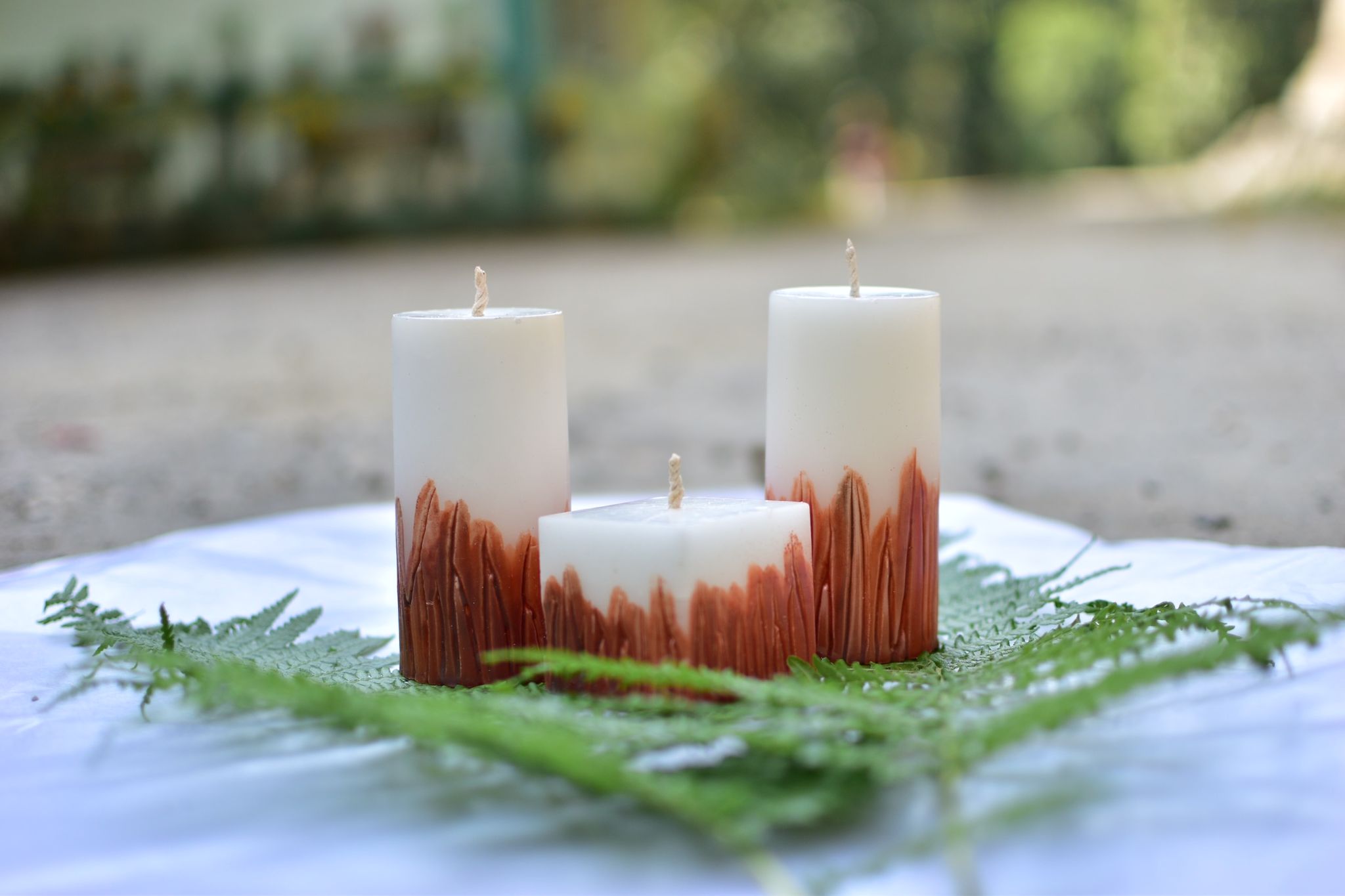 Hancarved straight leaves candle