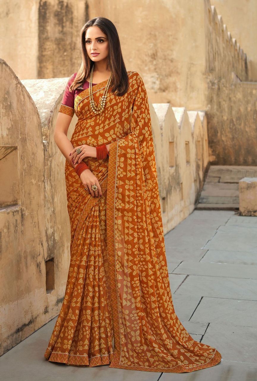 Orange Color Elegant Moss Chiffon Fabric Printed Saree With Fancy Thread Work Border And Maroon Fancy Thread Work Blouse Material.