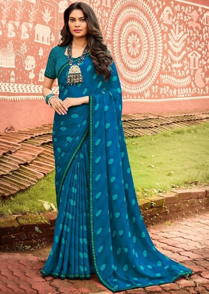Blue Color Georgette Saree With Fancy Border And Raw Silk Blouse Piece