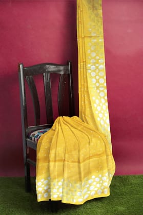 A Handloom Saree On A Yellow Base A Handloom Saree On A Yellow Base