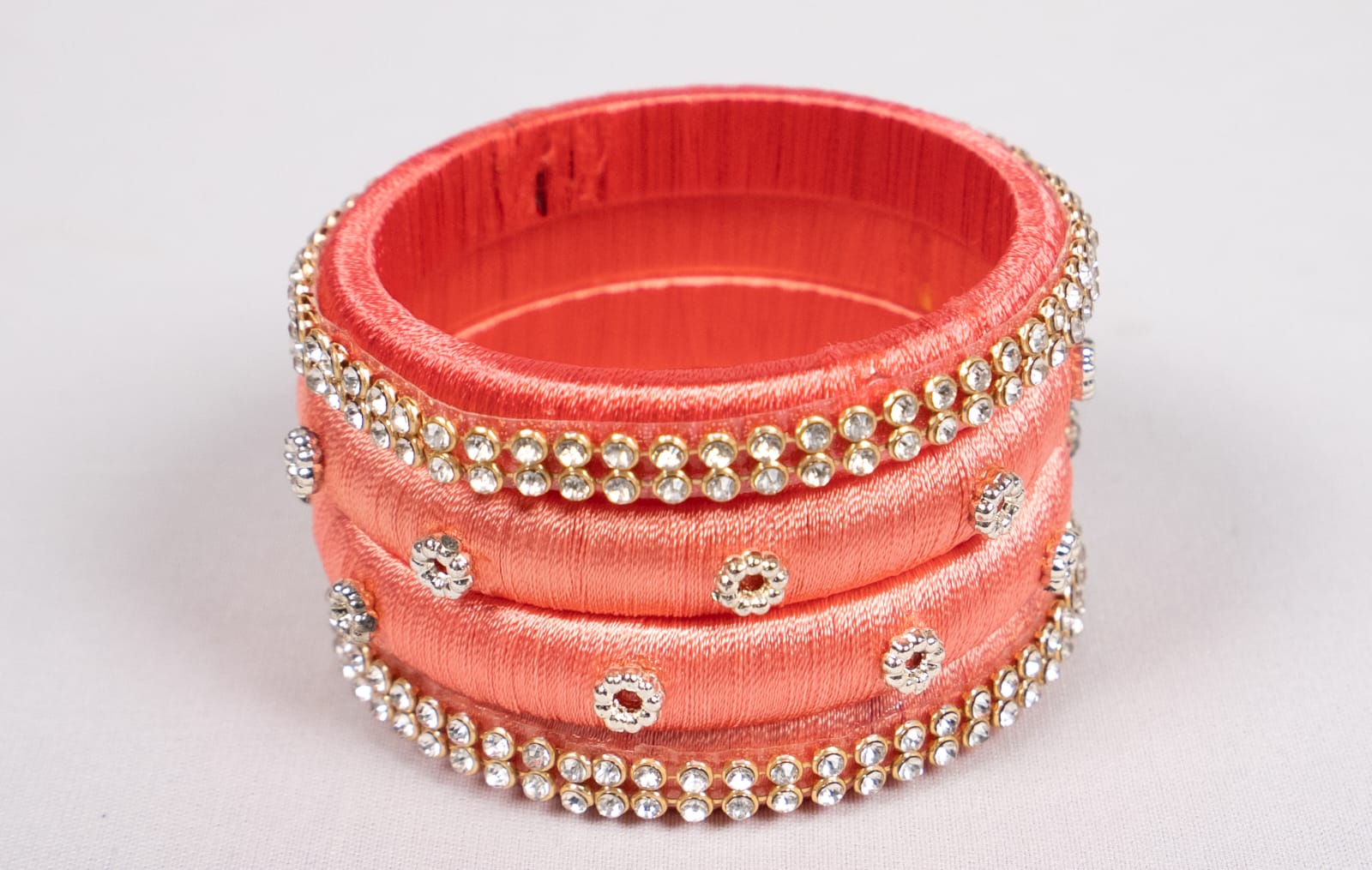  Peach and Pink Silk Thread Bangle Set with Rhinestone Accents
