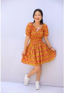 A cute floral dress with a shirred bodice and bubble sleeves