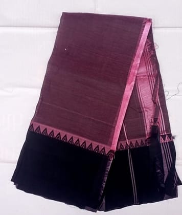 A beautiful handwoven cotton silk saree in a deep shade of aubergine with a black border featuring intricate geometric designs in zari. The saree is perfect for any formal occasion and will make you stand out from the crowd. A beautiful handwoven cotton silk saree in a deep shade of aubergine with a black border featuring intricate geometric designs in zari. The saree is perfect for any formal occasion and will make you stand out from the crowd.