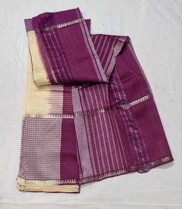 A beautiful and elegant handloom cotton saree with zari border in purple color A beautiful and elegant handloom cotton saree with zari border in purple color
