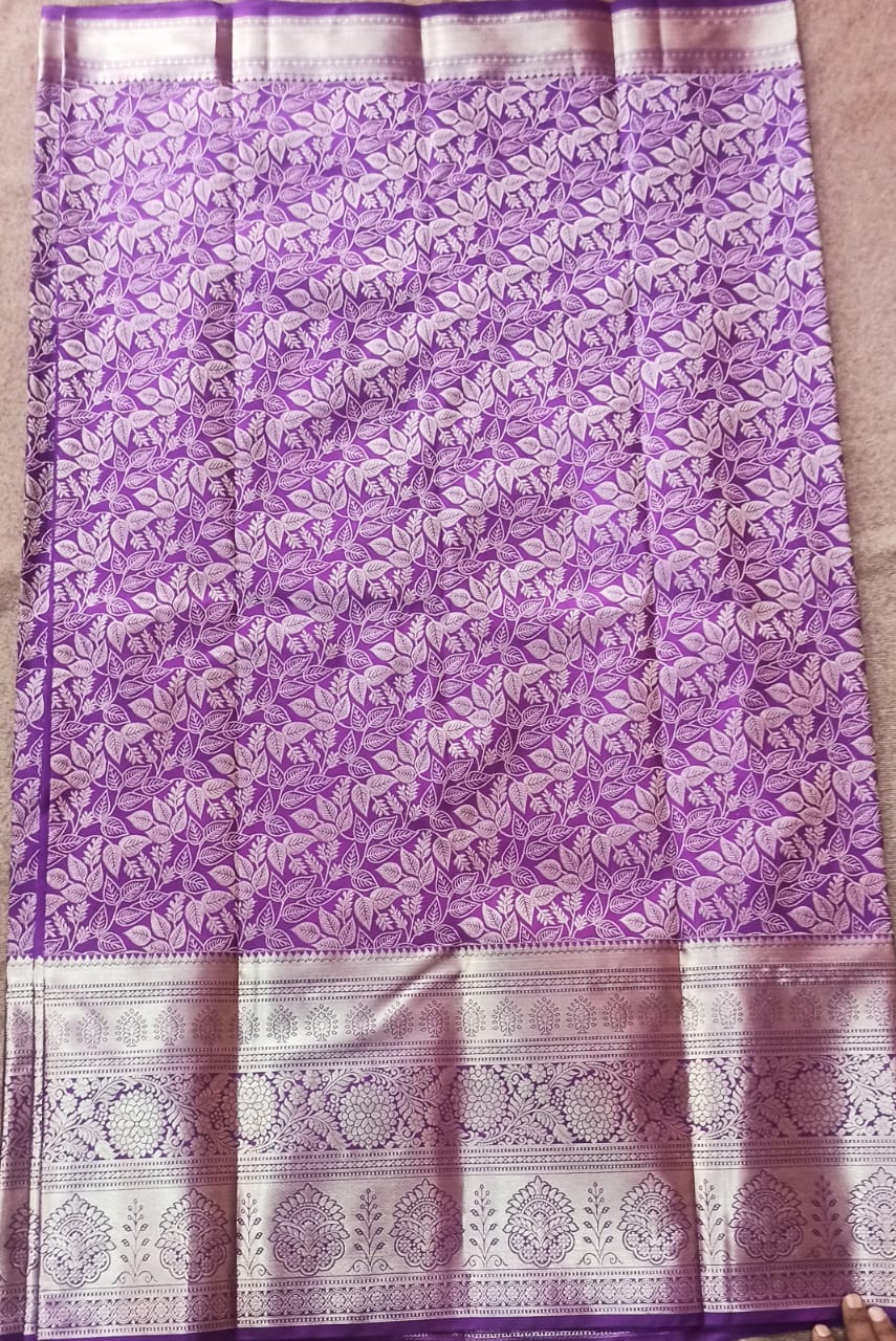Green and gold zari woven Kanchipuram silk saree with contrast border