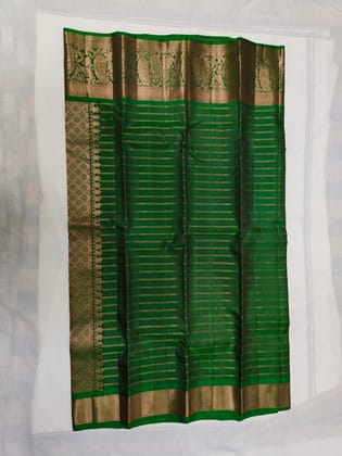 Green and Gold Silk Saree with Peacock Motifs Green and Gold Silk Saree with Peacock Motifs