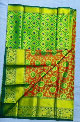 Green and red traditional silk saree with floral motifs Green and red traditional silk saree with floral motifs