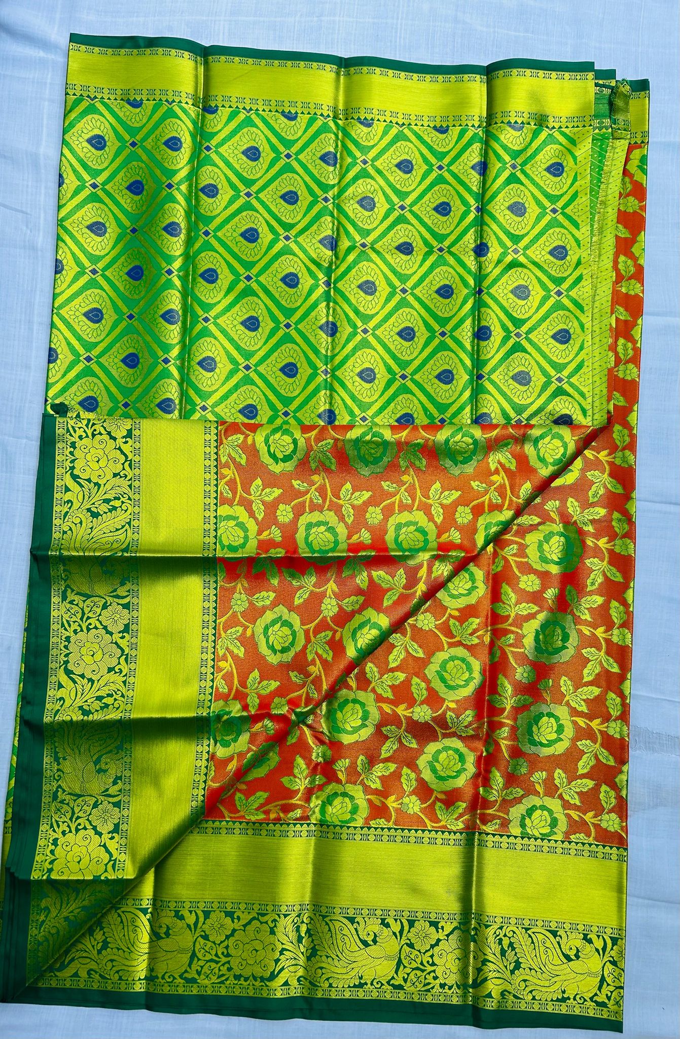 Green and red traditional silk saree with floral motifs