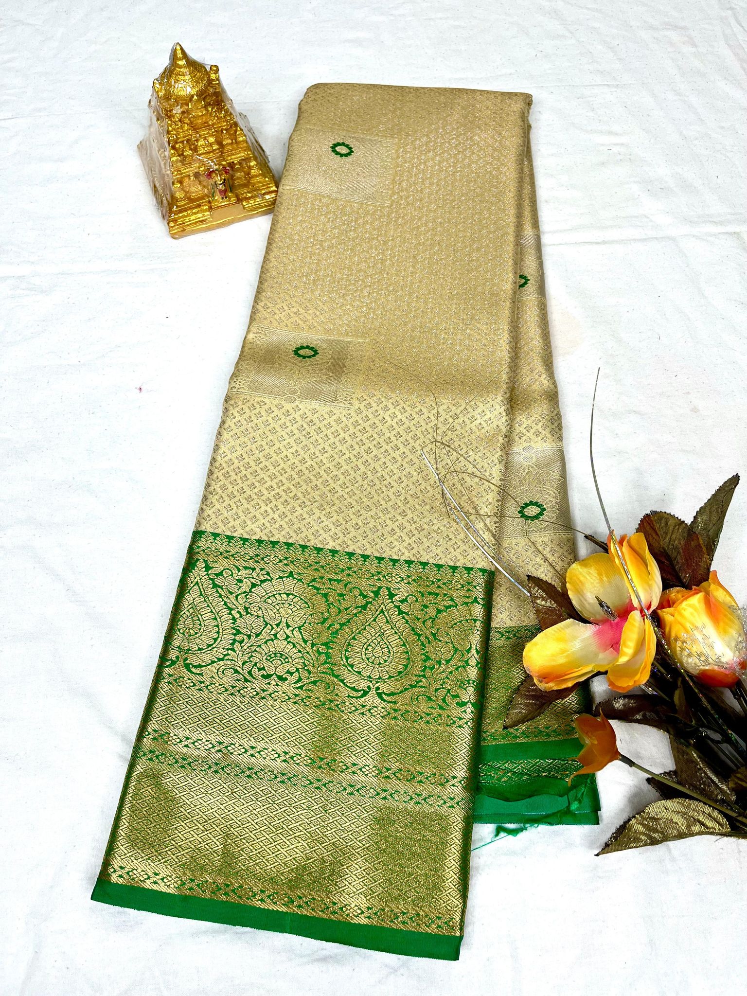 Golden color with Green accents and gold zari woven Kanjivaram silk saree
