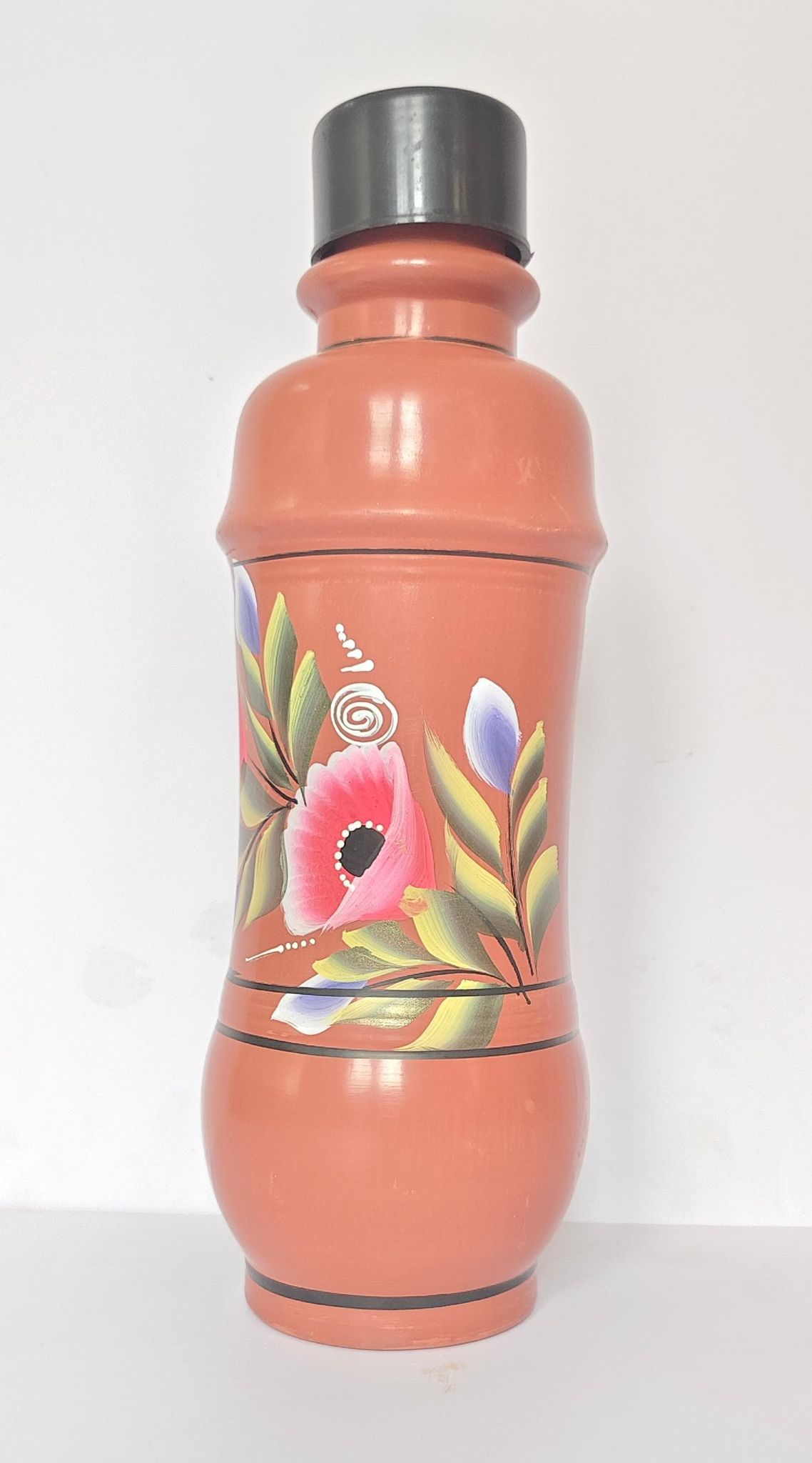 Handmade clay water bottle with floral design