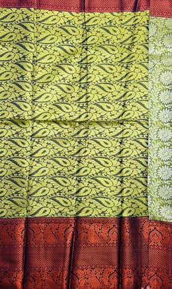Green and gold zari woven Kanjivaram silk saree with floral motifs Green and gold zari woven Kanjivaram silk saree with floral motifs