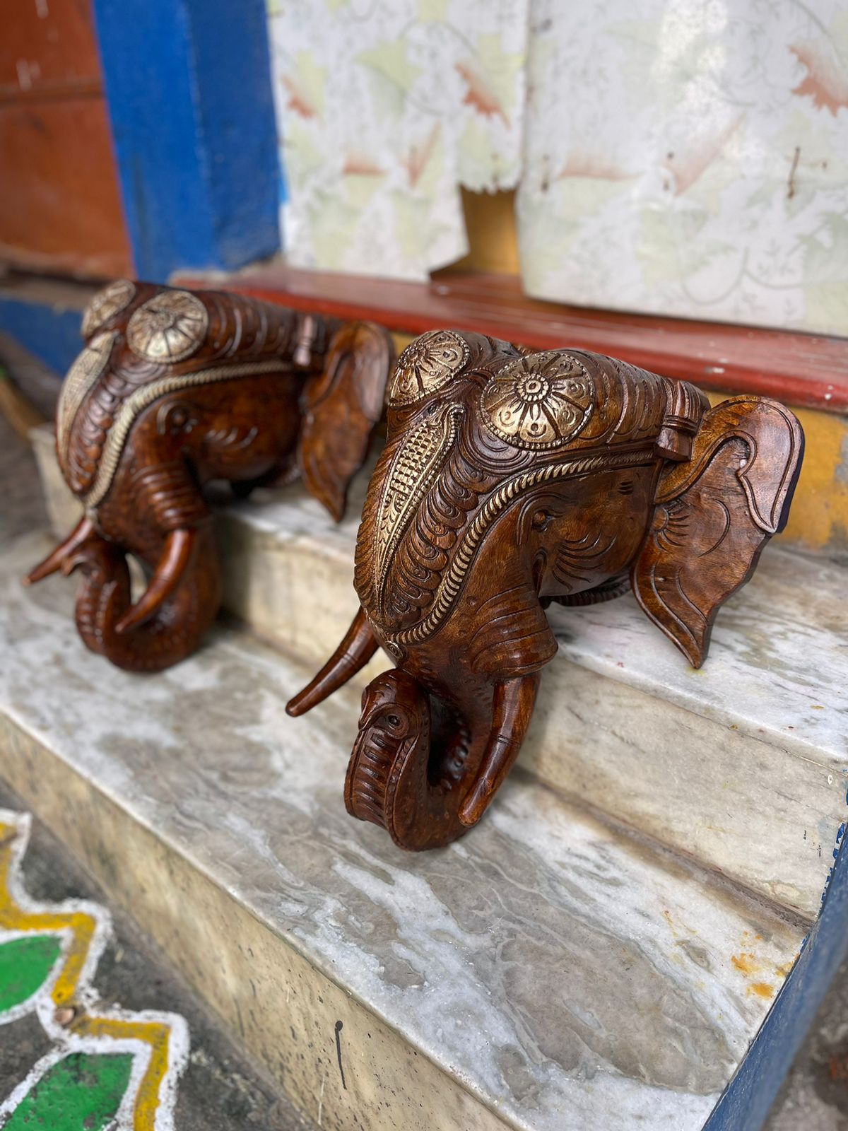  A Pair of Hand-Carved Wooden Elephant Head Wall Decor with Intricate Gold Detailing
