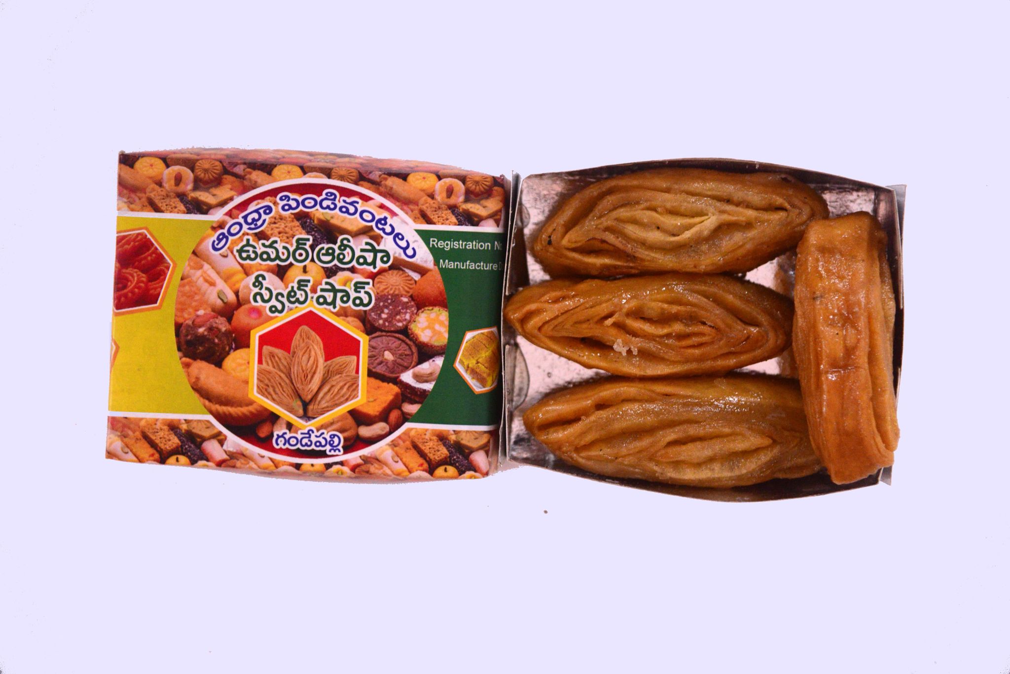 A box of four pieces of Mysore Pak, a traditional Indian sweet