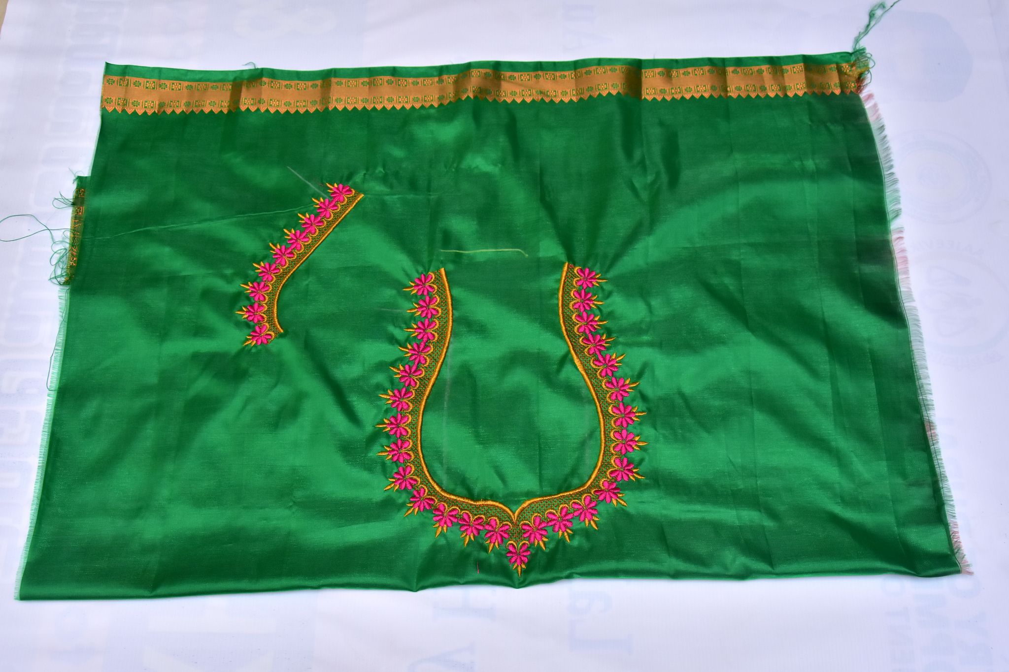 Green blouse with floral embroidery