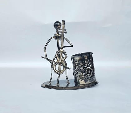  Metal sculpture of a man playing the cello