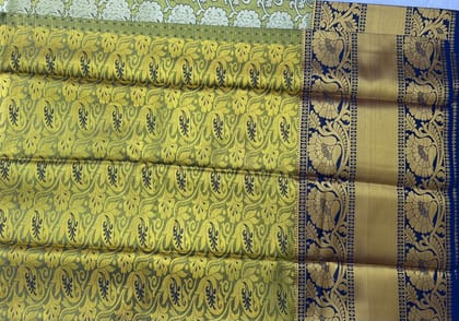 Green and gold zari woven Kanchipuram silk saree Green and gold zari woven Kanchipuram silk saree