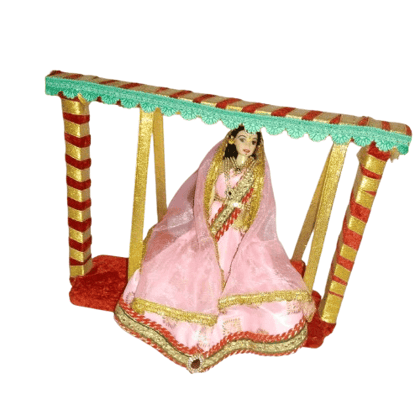 Exquisite Indian Bride Doll in Traditional Pink Lehenga on a Miniature Swing - Perfect for Home Decor and Gifting" Exquisite Indian Bride Doll in Traditional Pink Lehenga on a Miniature Swing - Perfect for Home Decor and Gifting"