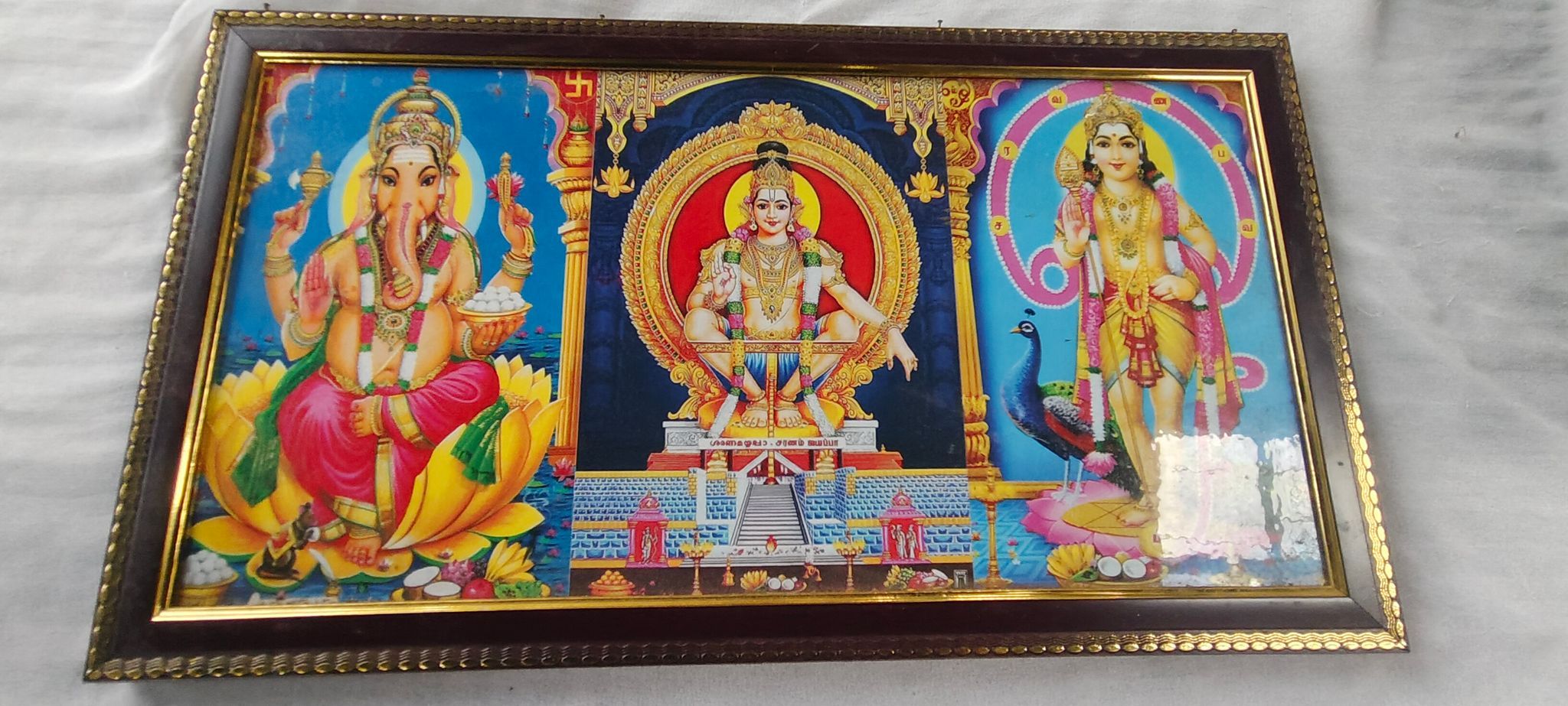 Lord Vishnu with Goddess Lakshmi and Lord Ganesha in a beautiful photo frame