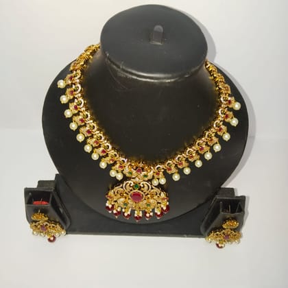 Traditional Indian necklace set with intricate detailing and pearl drops Traditional Indian necklace set with intricate detailing and pearl drops