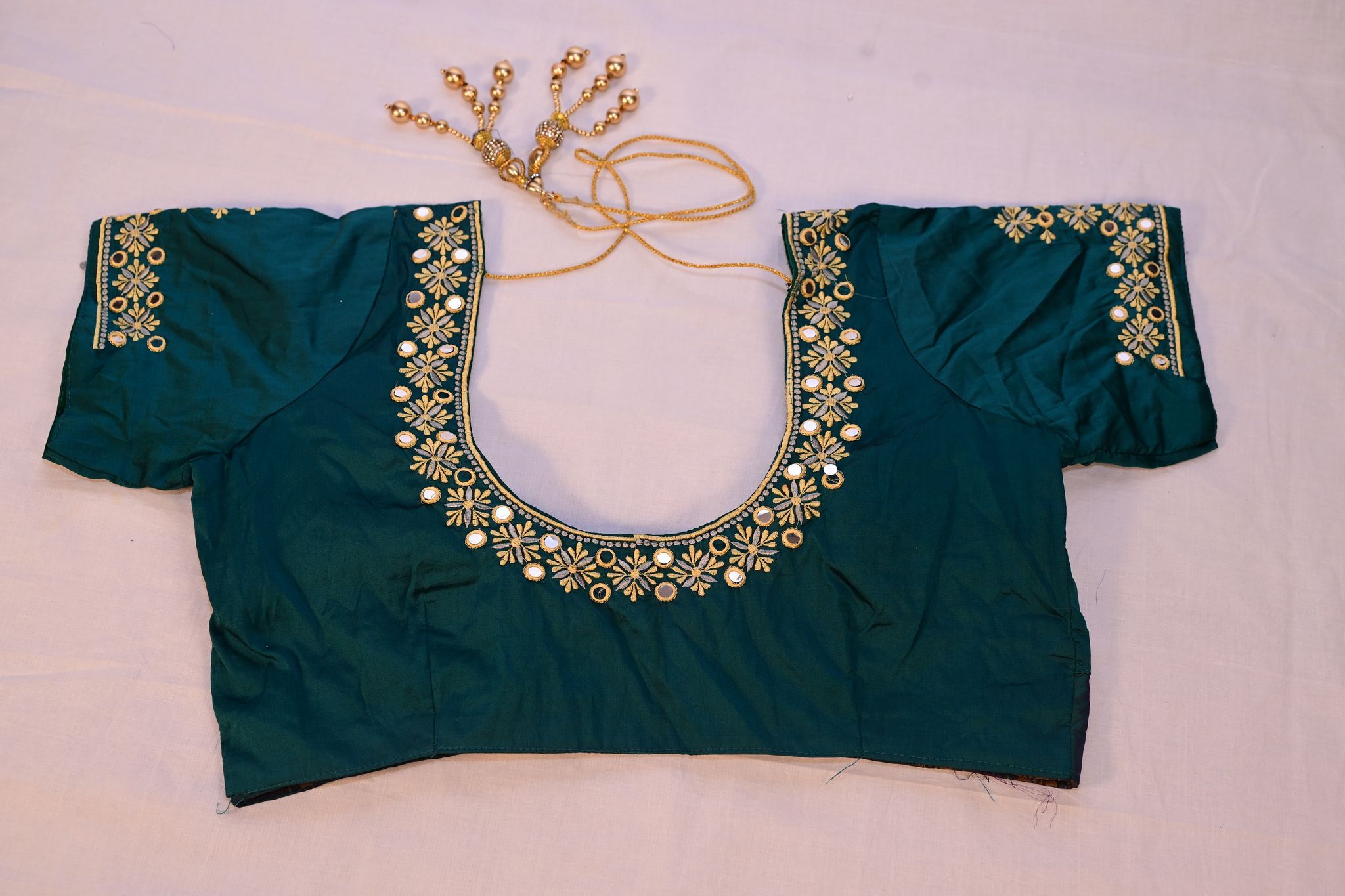 Green blouse with mirror work embroidery