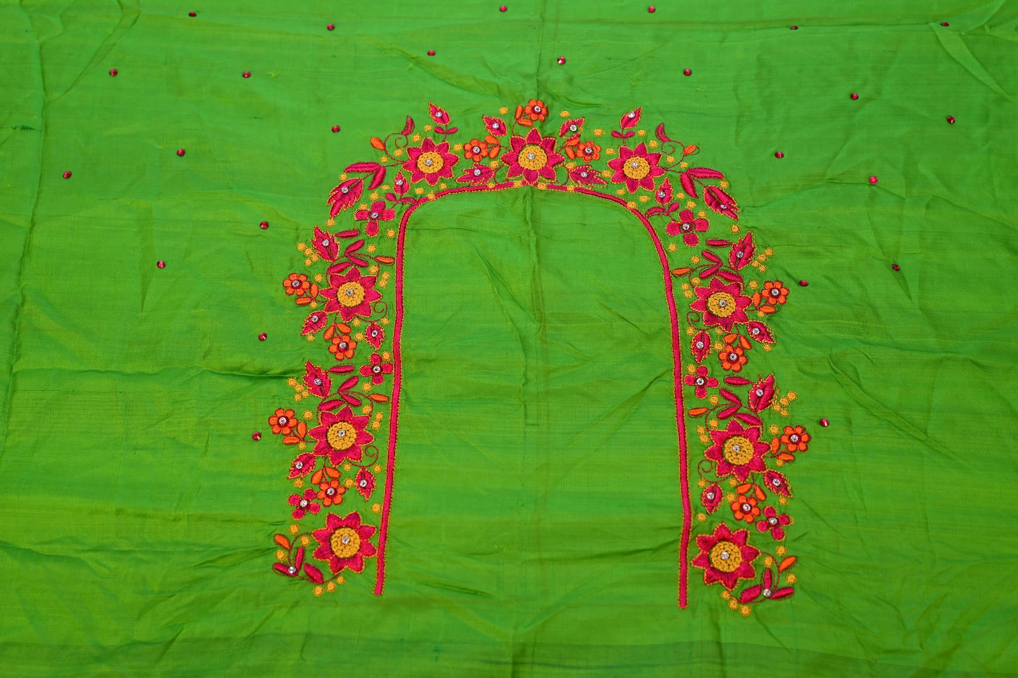 Green blouse with floral embroidery