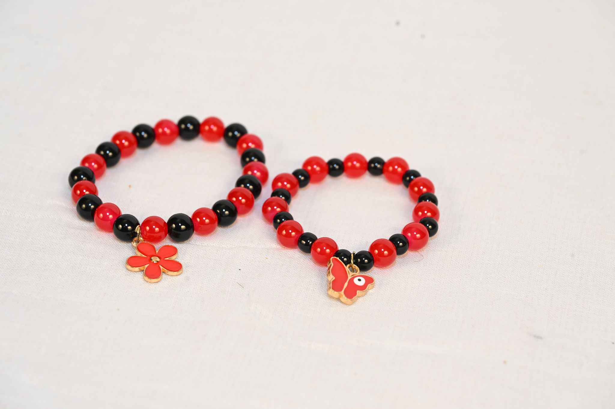 Red and black beaded charm bracelet