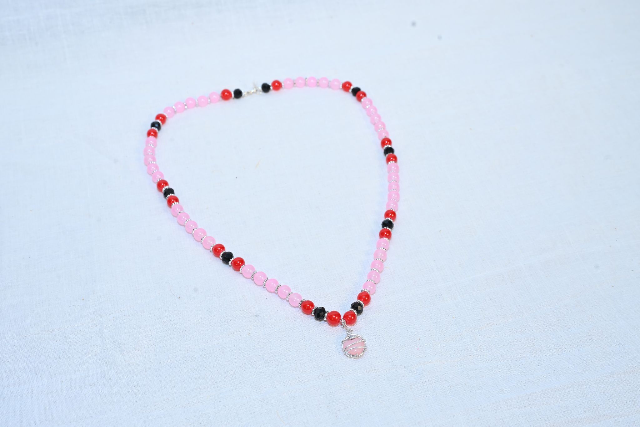 Pink and Black Beaded Necklace with Silver Pendant