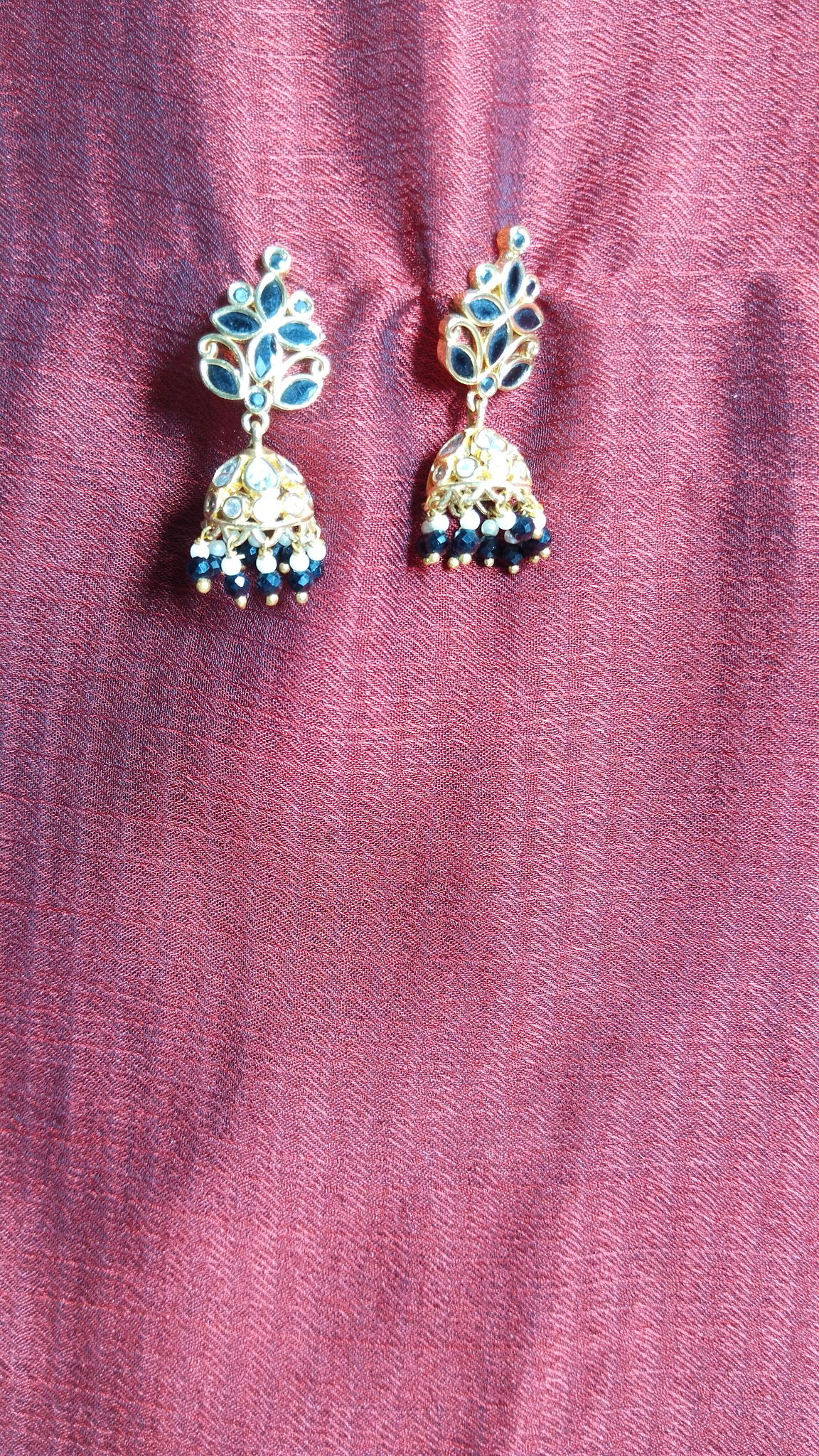 "Stunning Black and Gold Jhumka Earrings with Intricate Meenakari Work"