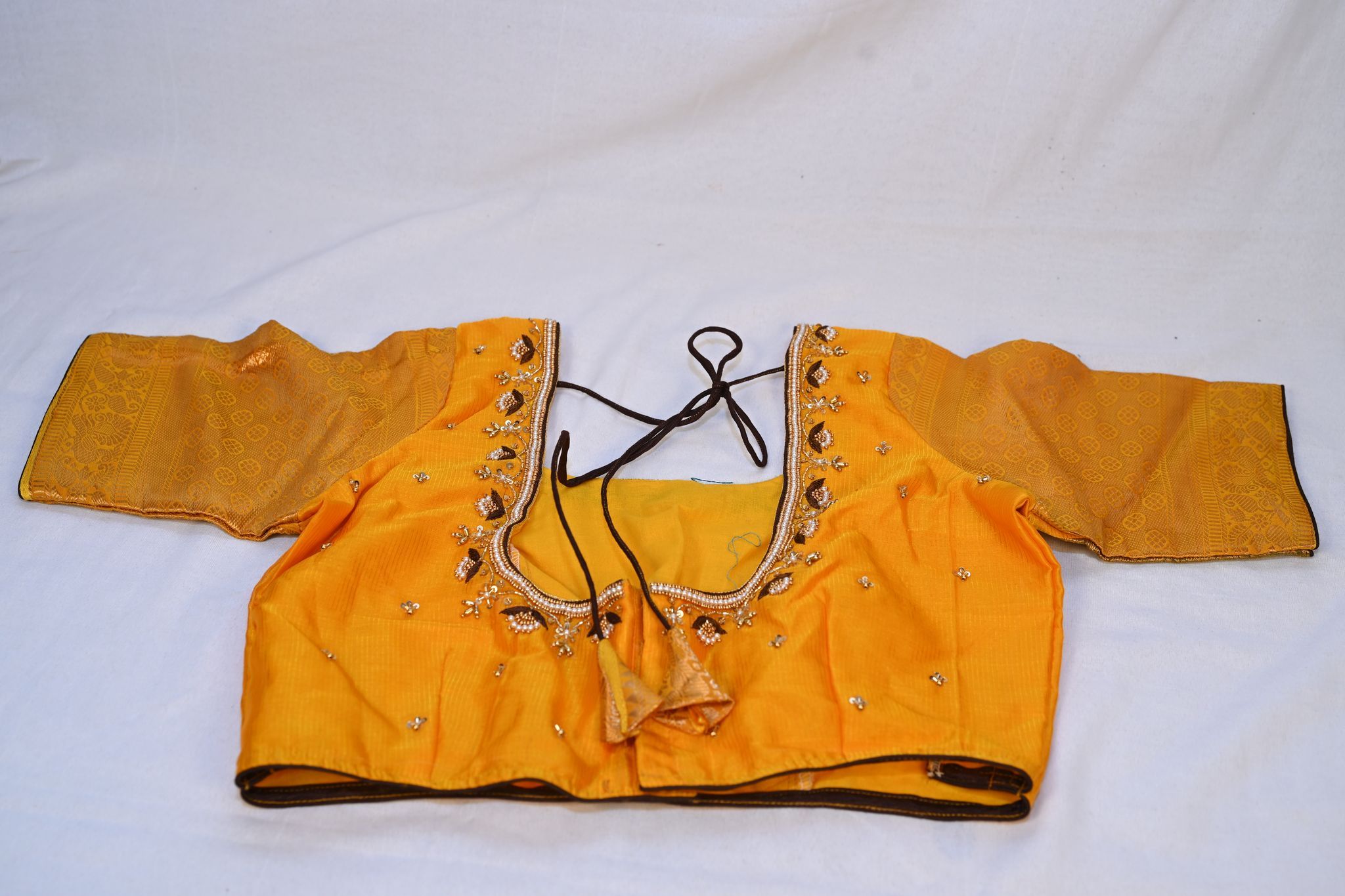 Yellow blouse with golden embroidery
