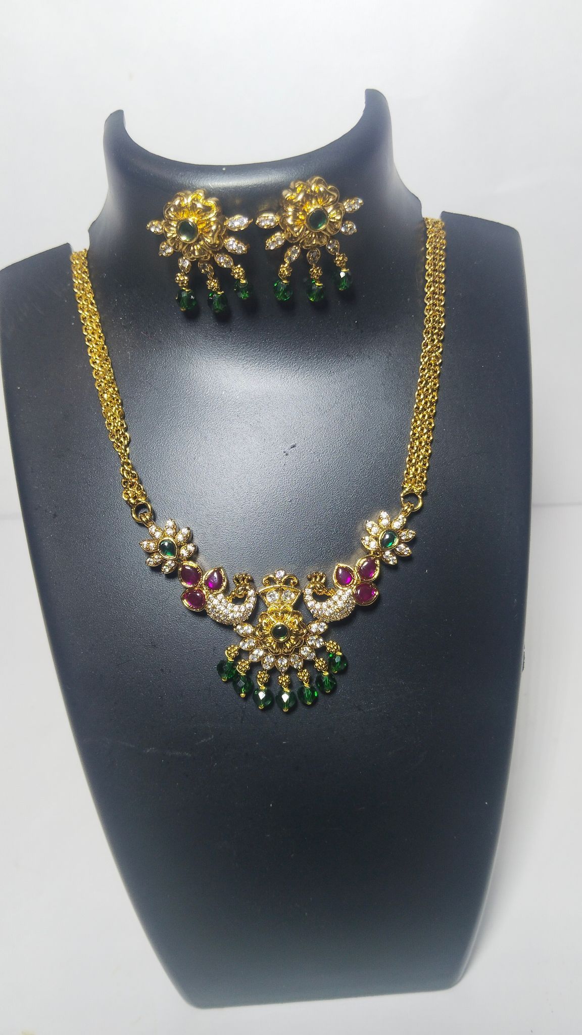 Gold-plated traditional Indian necklace set with white and green stones