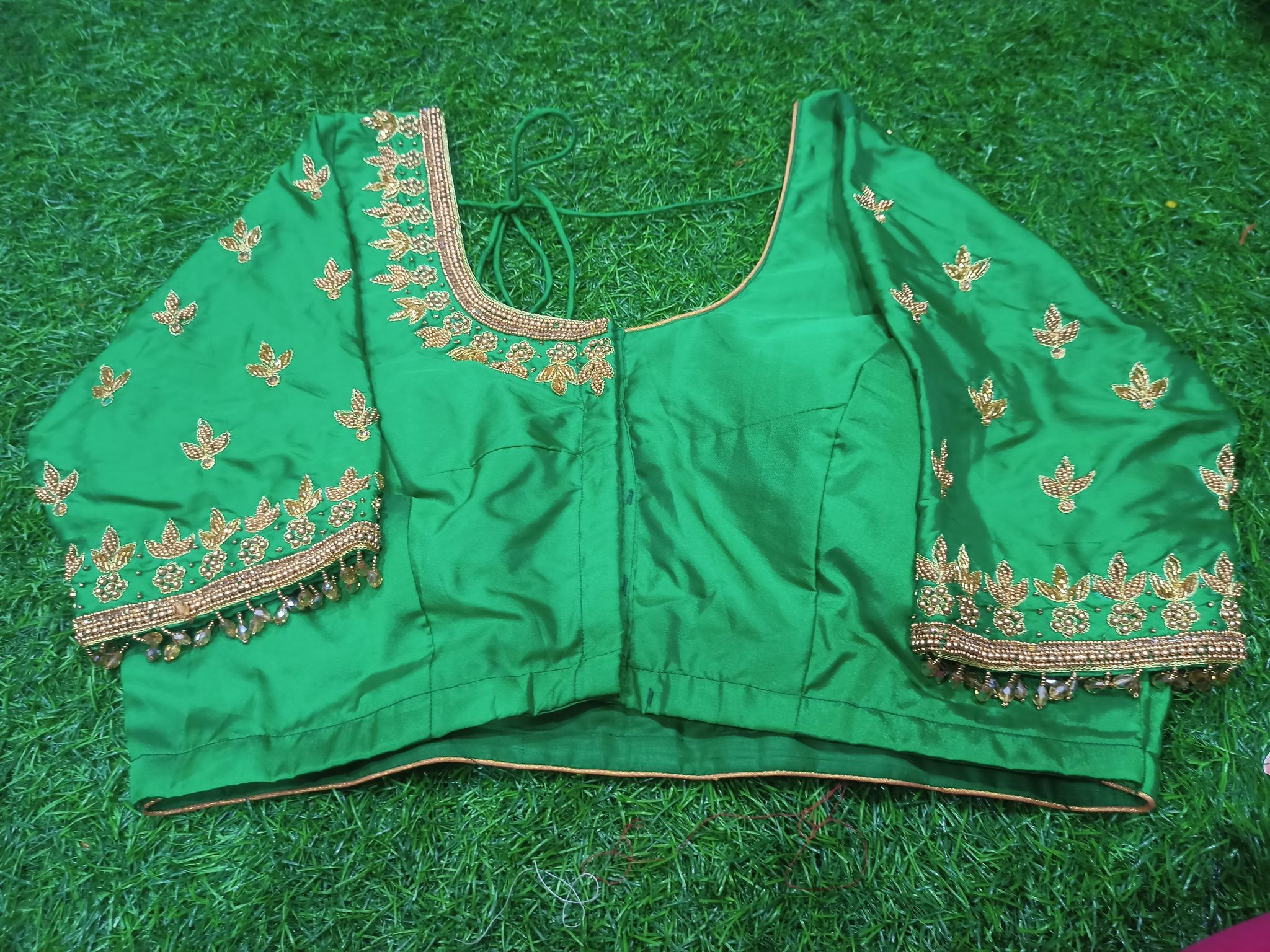 Green blouse with gotta patti work and pearl hangings