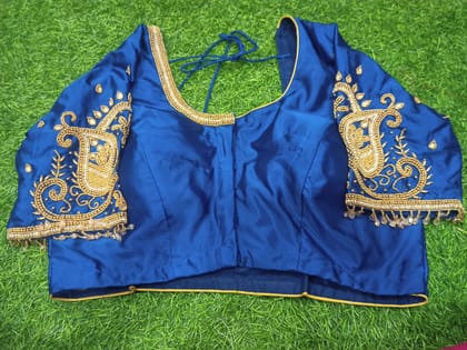 Blue blouse with intricate golden embroidery and mirror work Blue blouse with intricate golden embroidery and mirror work