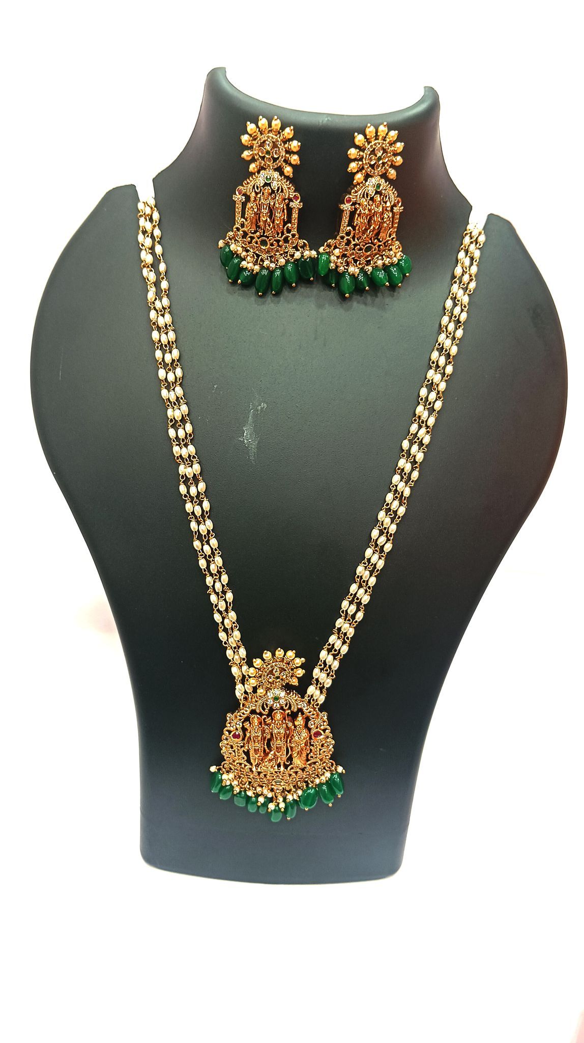 Gold-plated, pearl, and green stone necklace set with intricate detailing
