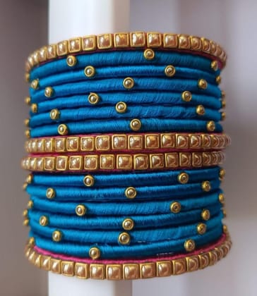 Set of 16 Blue Silk Thread Bangles with Golden Beads and Pink Stones