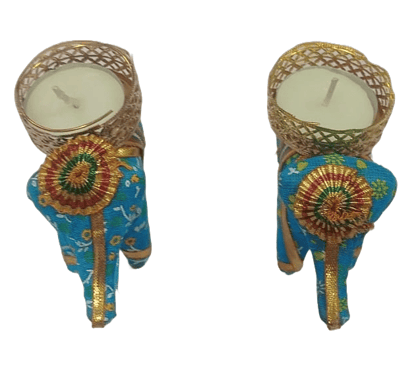 A pair of blue elephant tealight candle holders