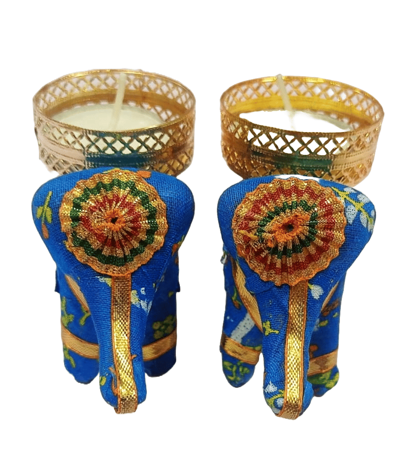 A pair of handcrafted blue elephant tealight candle holders