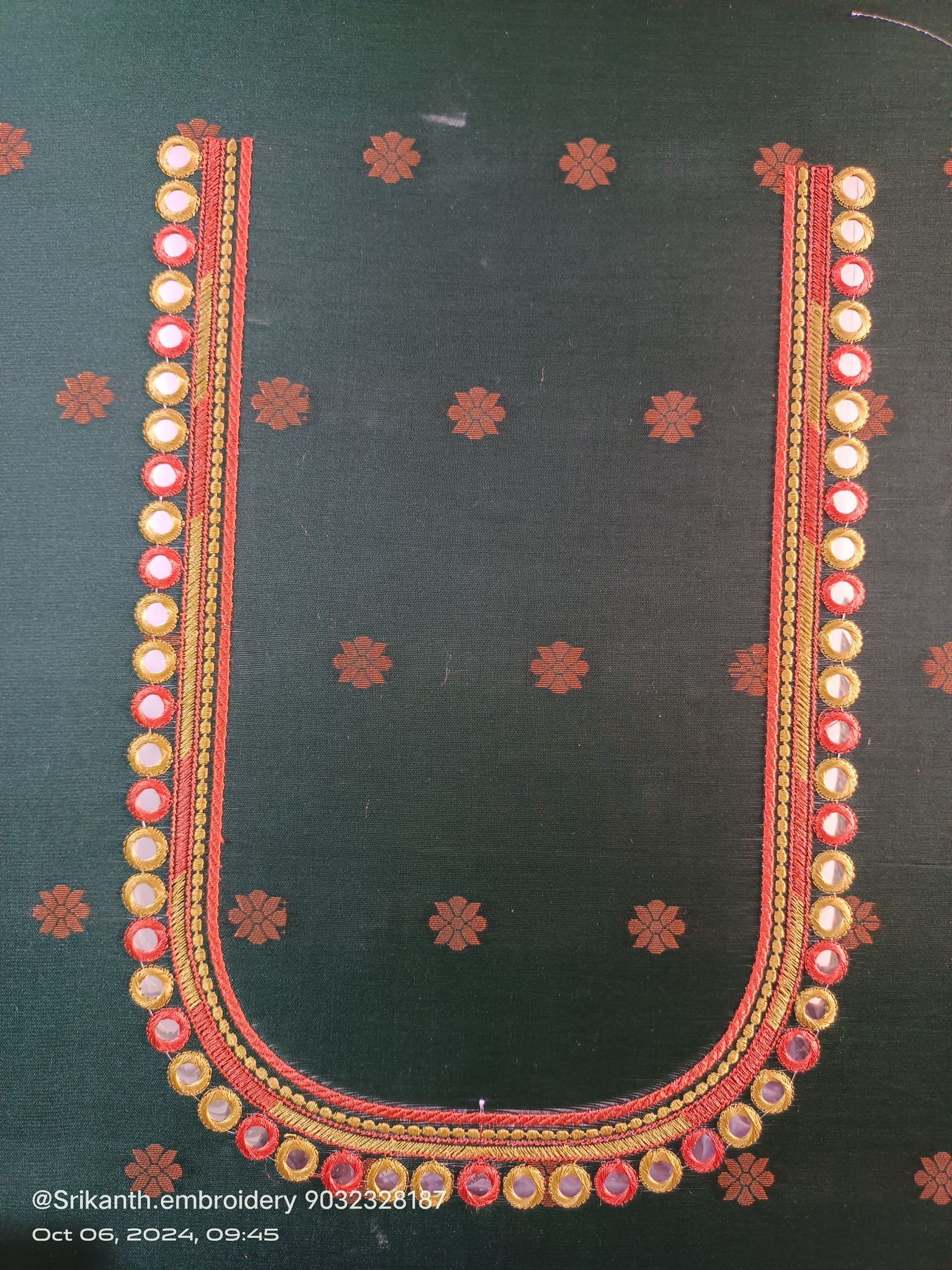 Red and gold embroidered blouse neck design with mirror work