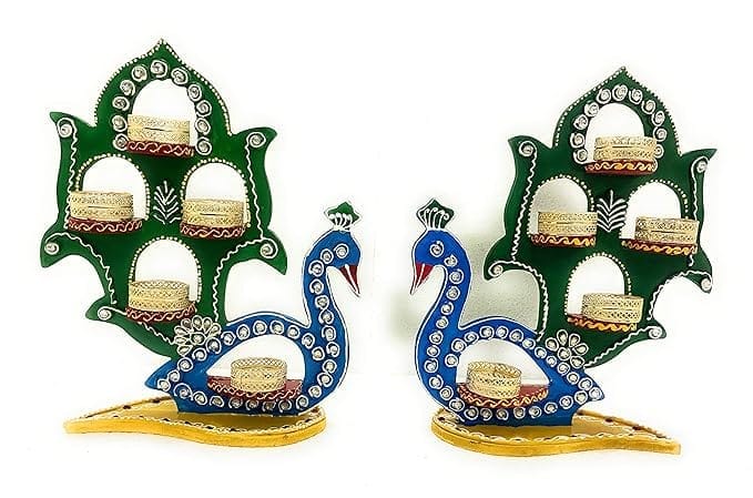 The title of the product could be "Exquisite Peacock Tealight Holder Set"