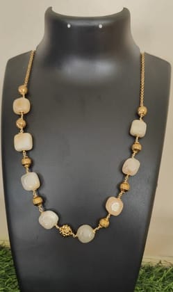 "Stunning Golden Beaded Necklace with a Floral Centerpiece"