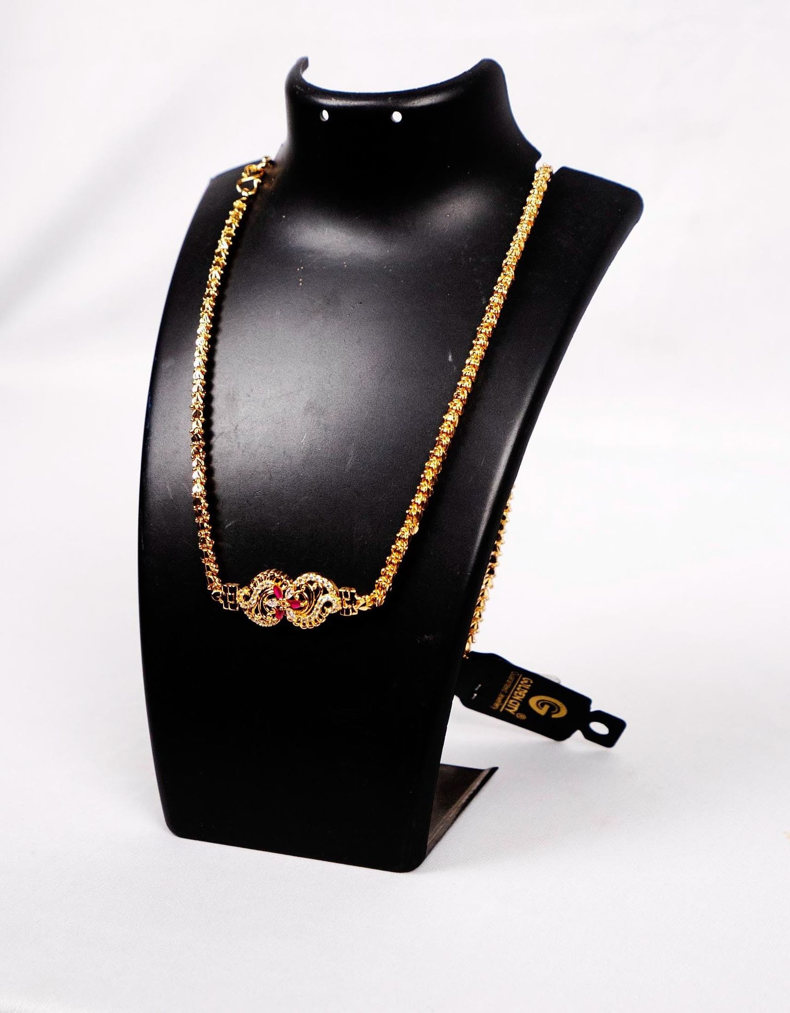 Delicate Gold Plated Chain with Intricate Pendant and Red Stone