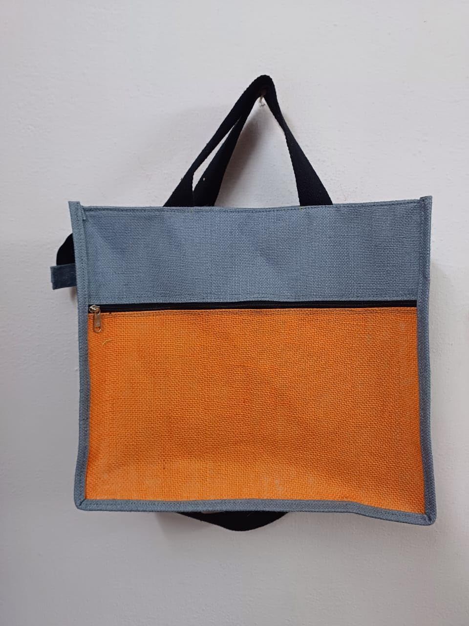 Jute tote bag with zippered main compartment and front pocket