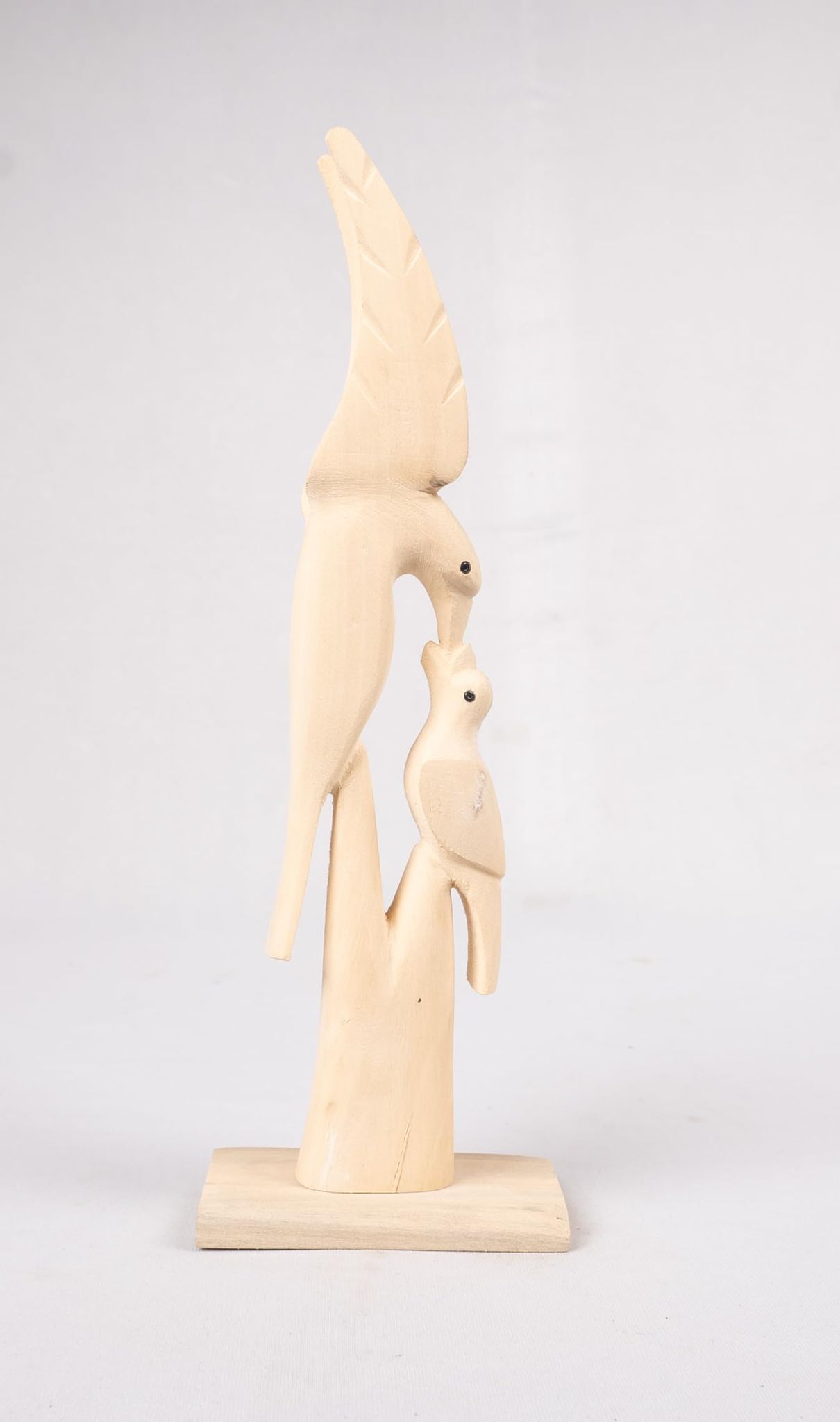 Hand carved wooden sculpture of a bird family