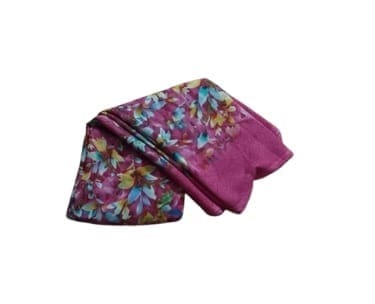 A beautiful lightweight scarf with a floral print in shades of pink, blue, yellow, and green.