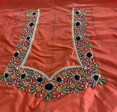 Orange Hand Embroidered Blouse With Zari And Pearl Work