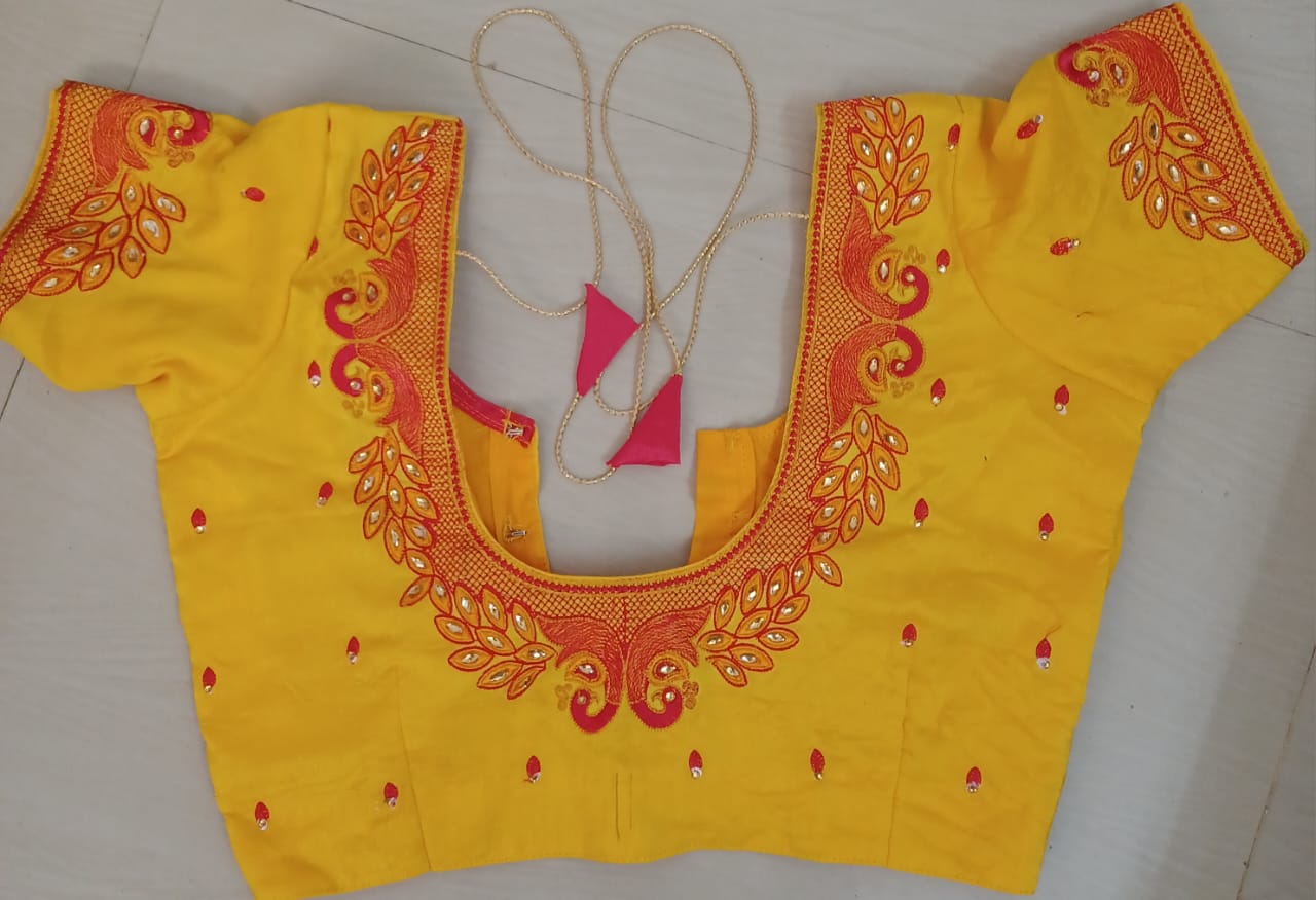 Yellow blouse with intricate zari and peacock embroidery