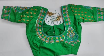 Green blouse with intricate zari and stone embroidery