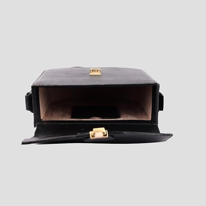Black leather camera bag with gold hardware