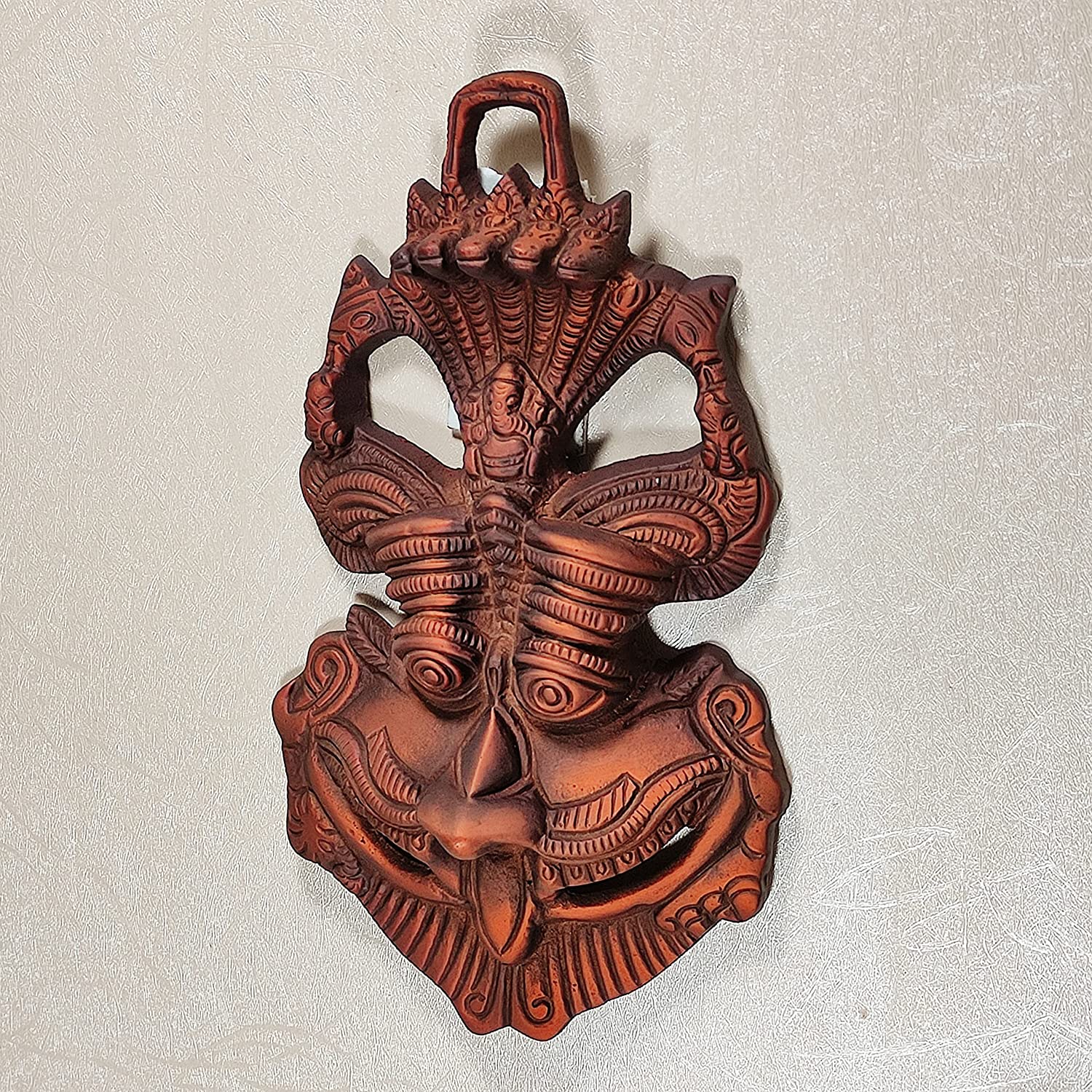 DreamKraft Wall Hanging Metal Face Mask Nazar Battu Evil Eye Protector, Wall Mounted Nazar Suraksha Kawach, Evil Eye Hanging for Home & Office Entrance (Copper - 16.5 x 3 x 9.5 cm)