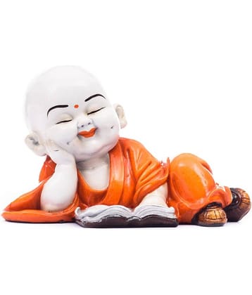 eCraftIndia White & Orange Polyresin Fangshui Baby Monk Buddha Statue Reading Book Decorative Showpiece
