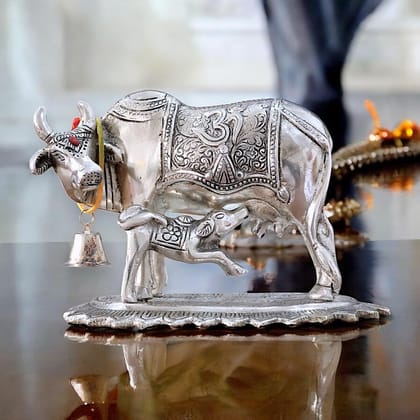 Dreamkraft Metal Om Kamdhenu Cow and Calf Statue Idol for Home, Office & Table Decoration| Silver Finish (12.5 cm)